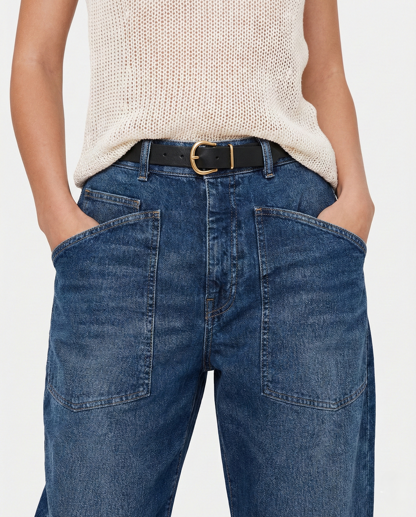 FJØRNA women's denim jeans with a barrel leg style, showcasing classic blue denim and relaxed fit.