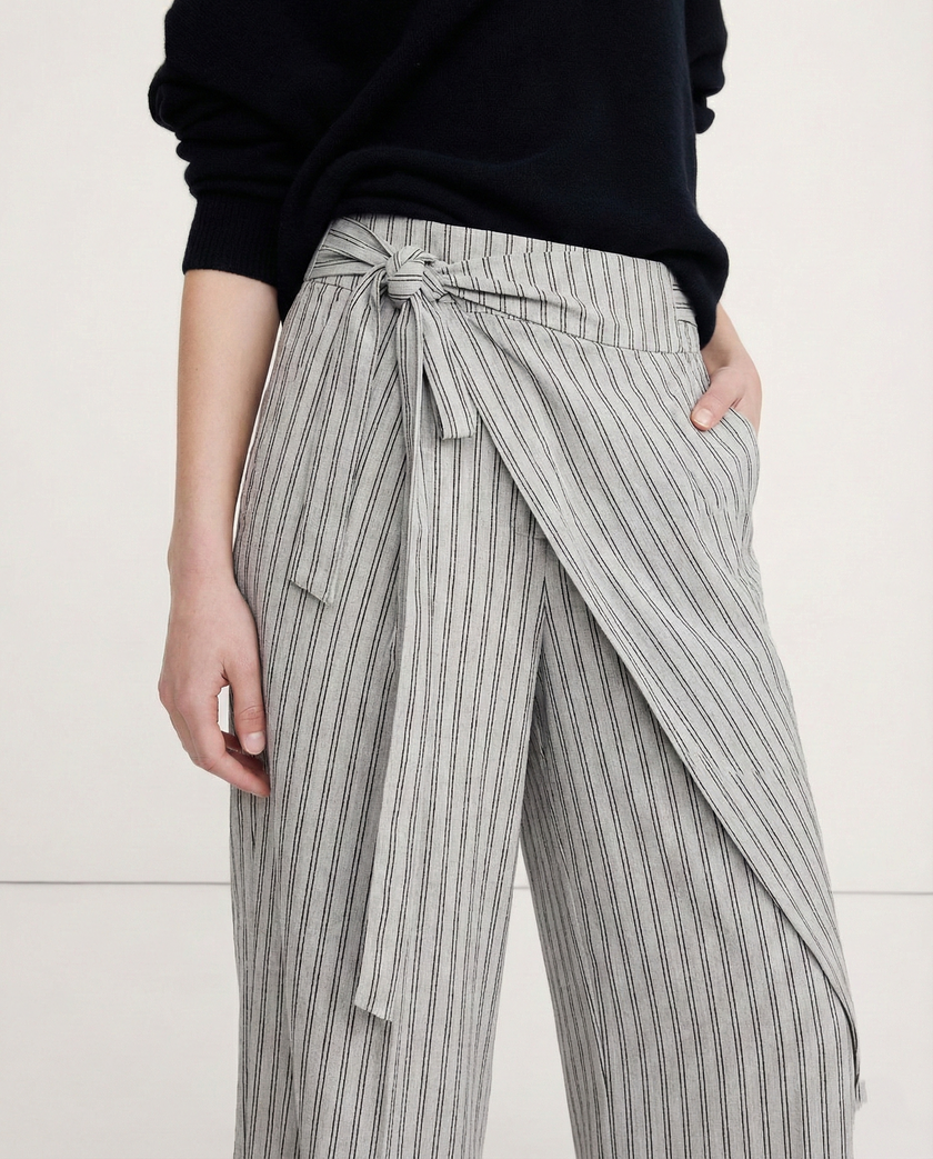 High-waist cotton wide-leg women's trousers by FJØRNA, showcasing relaxed fit and tailored design.