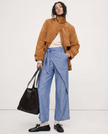 High waist cotton wide leg women's trousers from FJØRNA, showing the relaxed fit and smooth fabric in a natural pose.