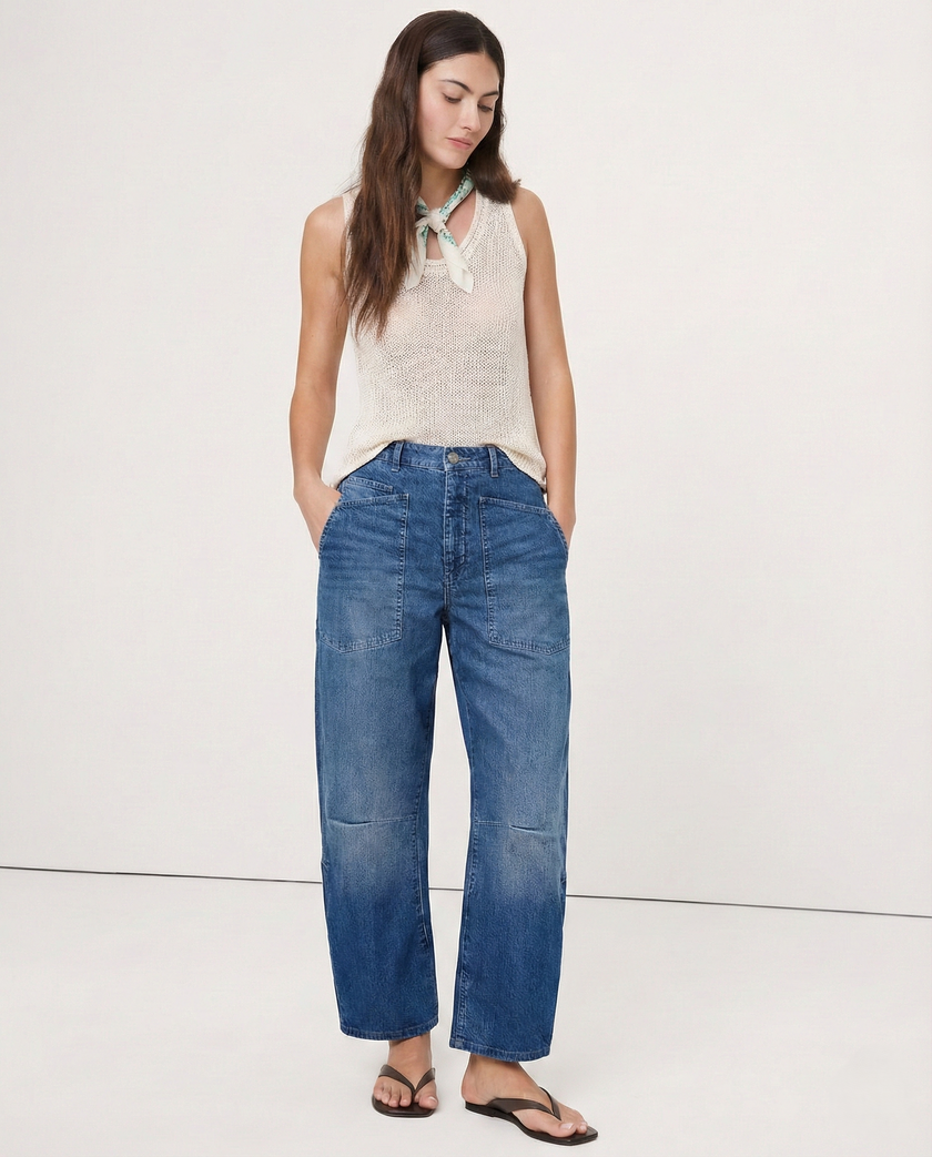 Women’s denim jeans with barrel leg style by FJØRNA, featuring classic blue denim and relaxed fit.