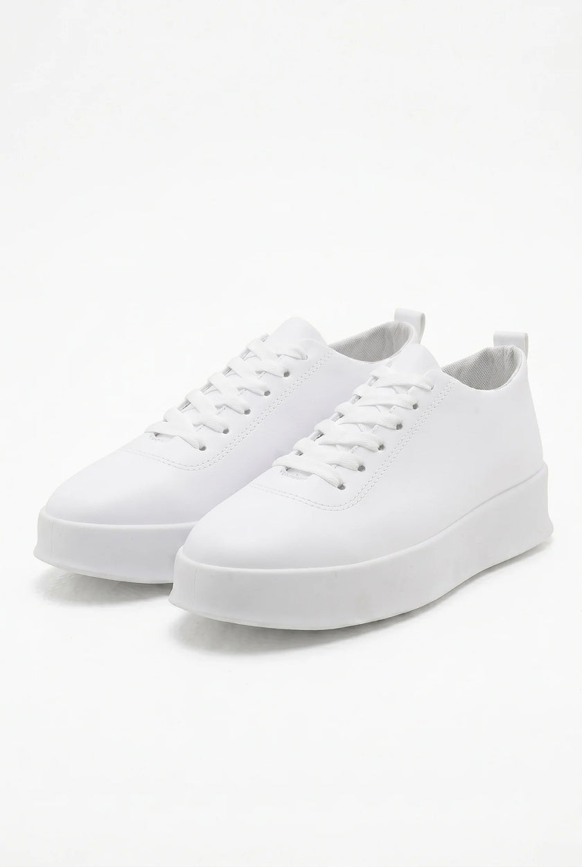 White FJØRNA men's slip-on trainers with a clean, minimalist design, perfect for casual and everyday wear.