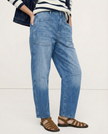 FJØRNA women's denim jeans with barrel leg style, showcasing classic blue pants with a relaxed fit and stylish design.