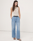 FJØRNA women's cotton wide-leg high-waist jeans, shown in a natural pose, highlighting the relaxed fit and stylish design.