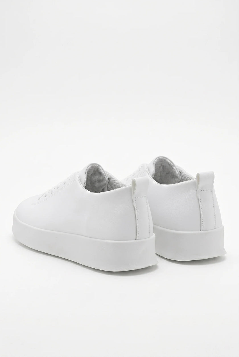 White FJØRNA men's slip-on trainers with clean, minimalist design, casual shoes perfect for everyday wear.
