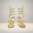 FJØRNA women's stiletto sandals with butterfly wrap design and rhinestone accents, featuring a high heel and elegant style.