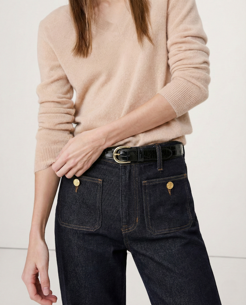 Women’s wide-leg cotton jeans by FJØRNA featuring high waist and relaxed fit, shown on a model.