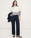 Women’s wide-leg cotton jeans with high waist, stylish pants by FJØRNA, shown in a natural pose on a neutral background.