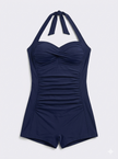 Women's shaping halter swimsuit by FJØRNA featuring pleated fit and supportive design, perfect for stylish swimming comfort.
