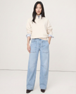 FJØRNA women's denim jeans with a barrel leg style, showcasing classic blue denim fabric and relaxed fit pants.