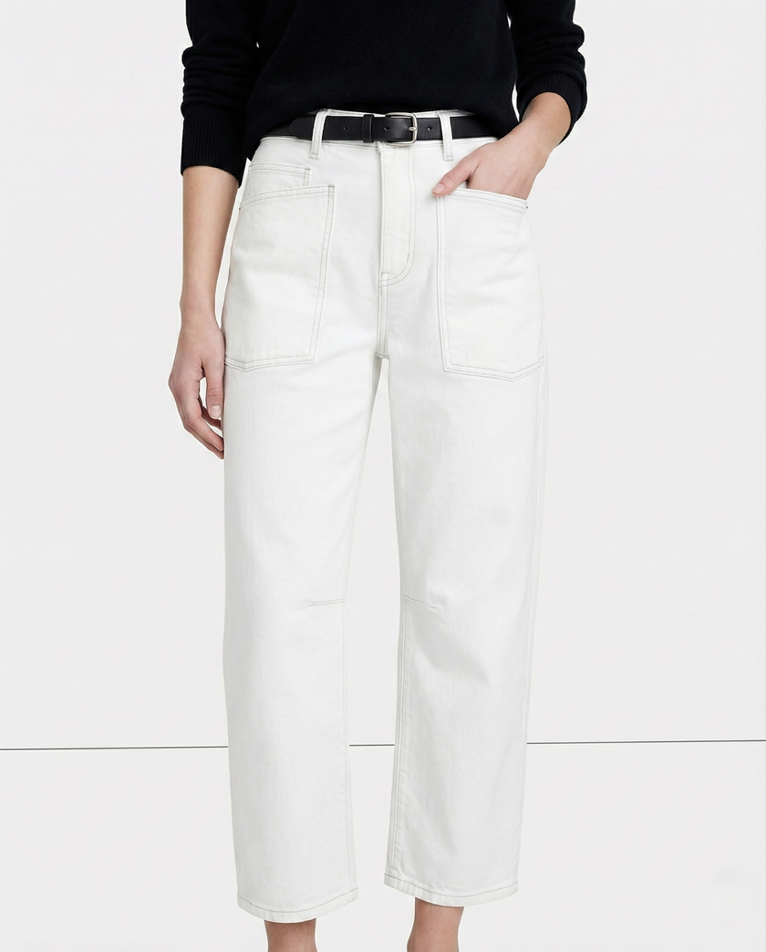 FJØRNA women's denim jeans with a barrel leg fit, showcasing classic blue denim, front pockets, and relaxed style.