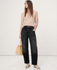 FJØRNA women's denim jeans with a barrel leg fit, showcasing classic blue denim and relaxed, stylish design.