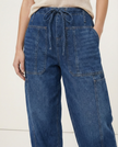 FJØRNA women's cotton pull-on jeans, casual pants with a comfortable fit, in a classic denim style, shown on a model.