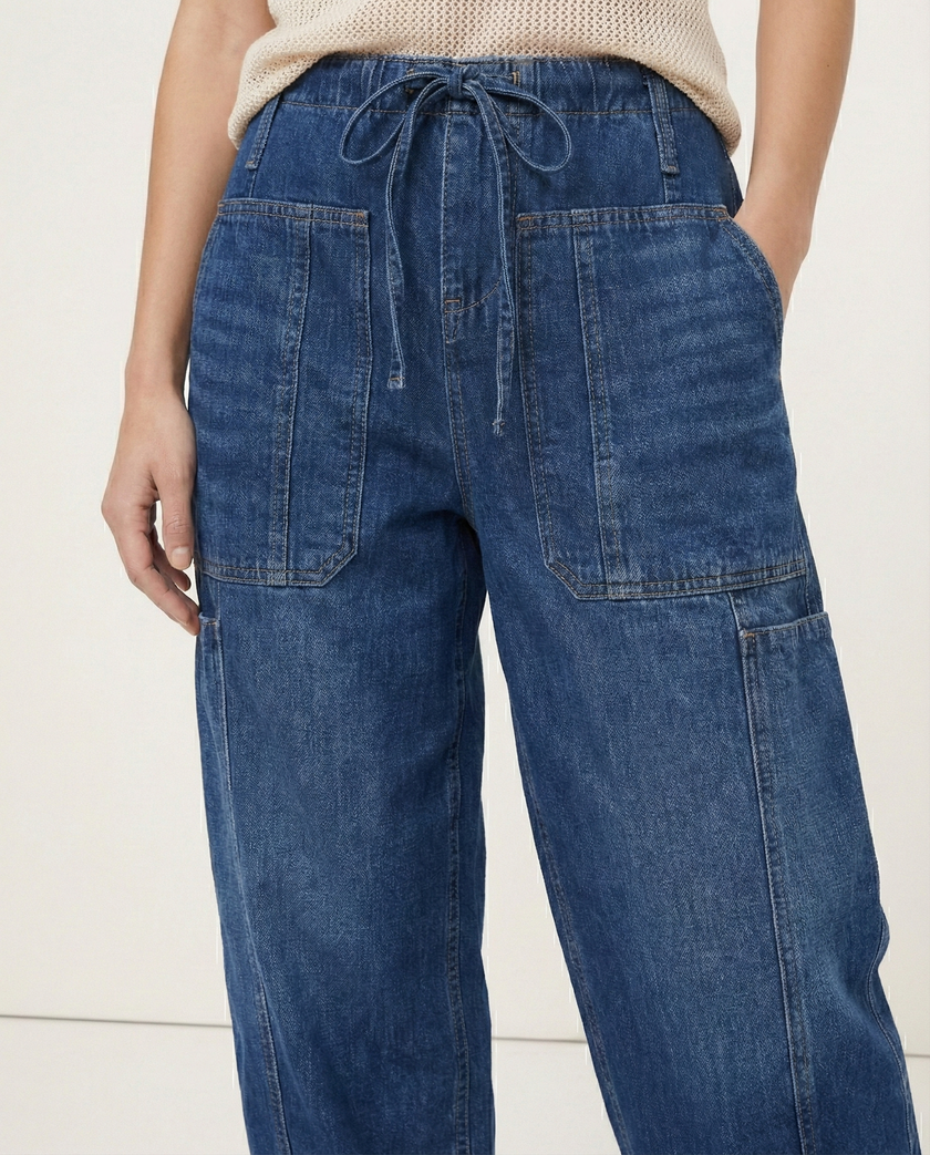 FJØRNA women's cotton pull-on jeans, casual pants with a comfortable fit, in a classic denim style, shown on a model.