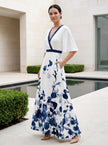 FJØRNA elegant floral maxi dress for women with V-neck and flutter sleeves, perfect for stylish summer occasions.