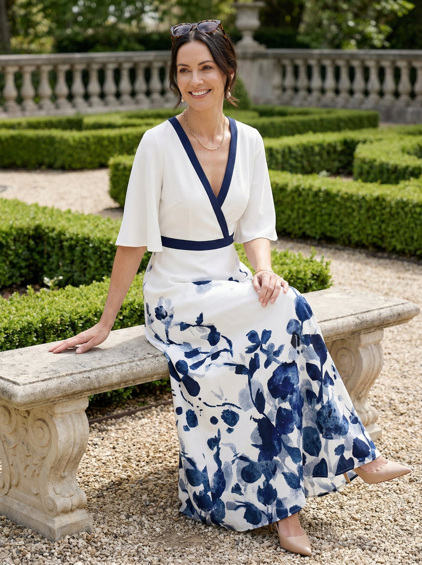 FJØRNA elegant floral maxi dress for women with V-neck and flutter sleeves, perfect for summer or special occasions.