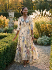 FJØRNA elegant floral maxi dress for women with V-neckline and flutter sleeves, perfect for stylish summer occasions.