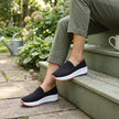 FJØRNA women's orthopedic sneakers with knit upper and arch support, designed for comfortable everyday wear.