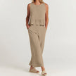 FJØRNA elegant two-piece women's linen co-ord set with ruffle details, featuring a stylish top and matching pants.