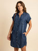 FJØRNA elegant women’s button-front evening dress displayed on a hanger, featuring a sleek design and classic style.