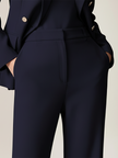 Navy lapel double-breasted two-piece suit set by FJØRNA, featuring tailored jacket and matching trousers on a model.