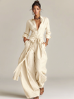 FJØRNA women's cotton-linen jumpsuit with shirt collar, long sleeves, and belt, styled as casual pants for women.