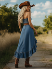 FJØRNA ruffle midi dress for women, flowing fabric with ruffled details, styled for elegant occasions.