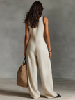 FJØRNA linen blend sleeveless jumpsuit for women with stand collar and embroidery detail, featuring stylish pants design.