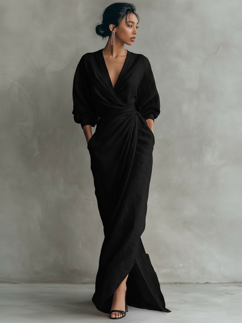 Elegant women's maxi dress by FJØRNA featuring a V-neckline and linen fabric, shown in a flowing, stylish design.
