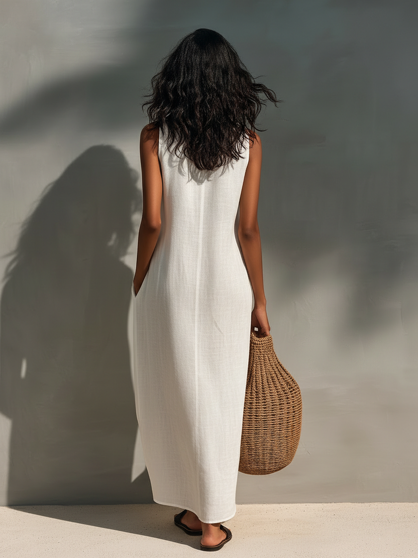 FJØRNA sleeveless maxi dress for women, flowing fabric, ankle-length, sleeveless design, ideal for summer or casual occasions.