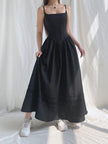 White Goth strap maxi dress by FJØRNA featuring a fitted silhouette and stylish strap details, ideal for edgy, modern fashion.