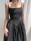 White goth strap maxi dress by FJØRNA, featuring a flowing silhouette and stylish strap details, perfect for edgy fashion looks.