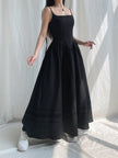FJØRNA Goth strap white maxi dress with black accents, flowing fabric, and edgy strap details, perfect for gothic-inspired fashion.