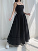 FJØRNA Goth strap white maxi dress with black accents, flowing fabric, and edgy strap details, perfect for gothic-inspired fashion.