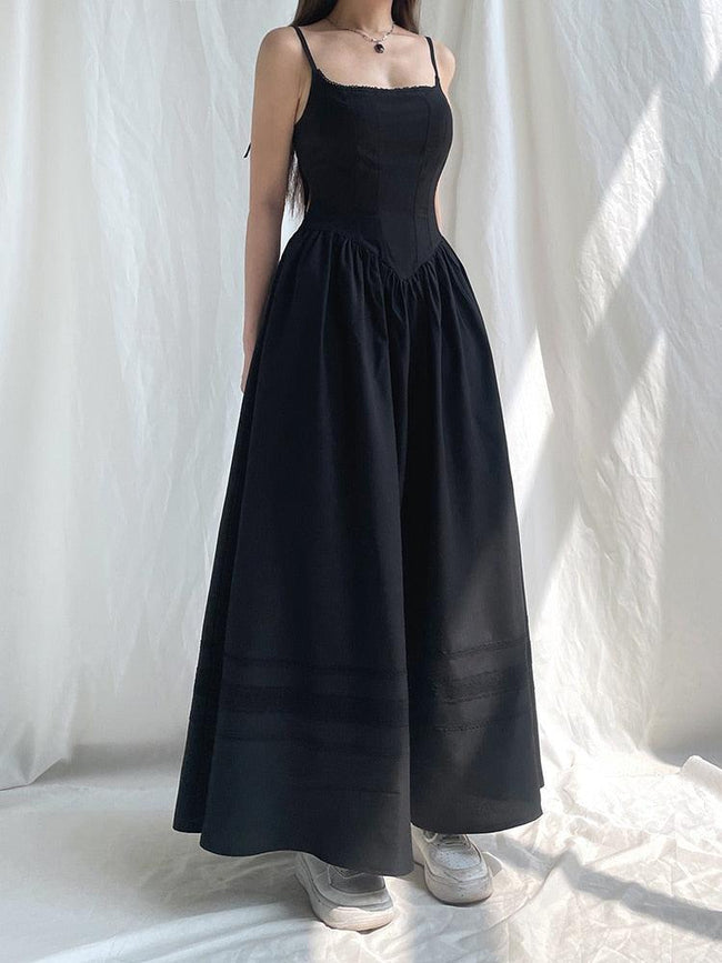 White Goth Strap Maxi Dress by FJØRNA featuring a flowing silhouette and stylish strap details.