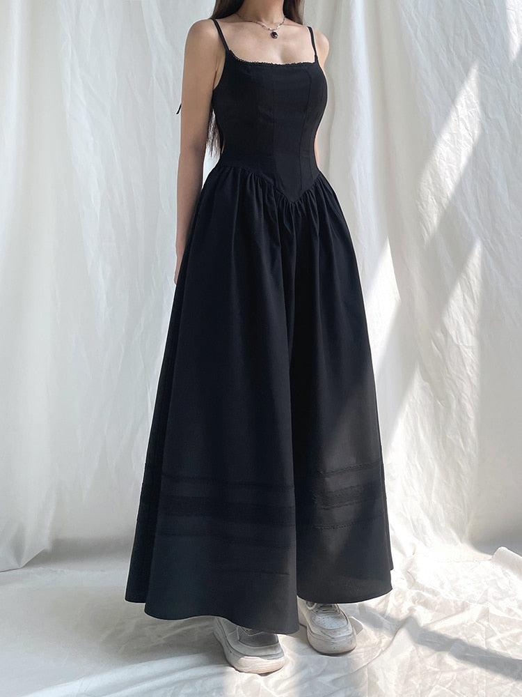 White Goth Strap Maxi Dress by FJØRNA featuring a flowing silhouette and stylish strap details.