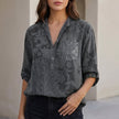 Gray floral V-neck denim summer blouse for women by FJØRNA, featuring lightweight fabric and stylish design.