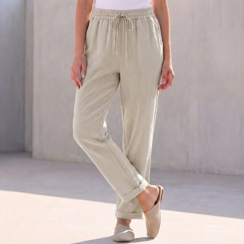 Gray linen women's summer trousers with a drawstring waist by FJØRNA, showcasing a relaxed and comfortable fit.