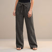 Gray high-waist summer trousers for women by FJØRNA, made of cotton, showcasing a relaxed fit and stylish design.