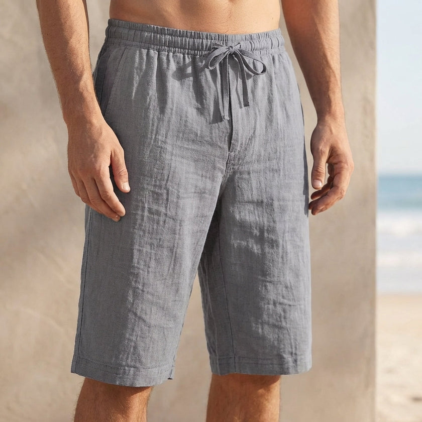 Gray men's casual knee-length chino shorts with adjustable drawstring waist from FJØRNA, ideal for vacation and relaxed summer wear.