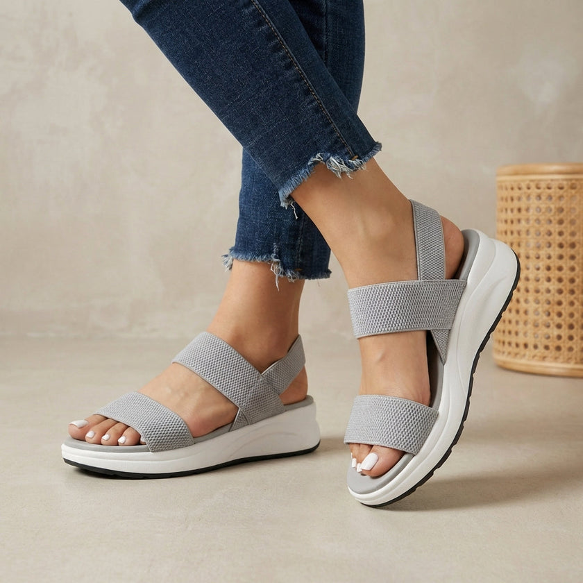 Gray FJØRNA women's orthopedic sandals with adjustable straps and flowy design, comfortable for everyday wear.