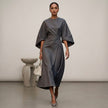 Gray FJØRNA batwing sleeve wrap maxi dress with belt and front slit, elegant and flowing for stylish occasions.