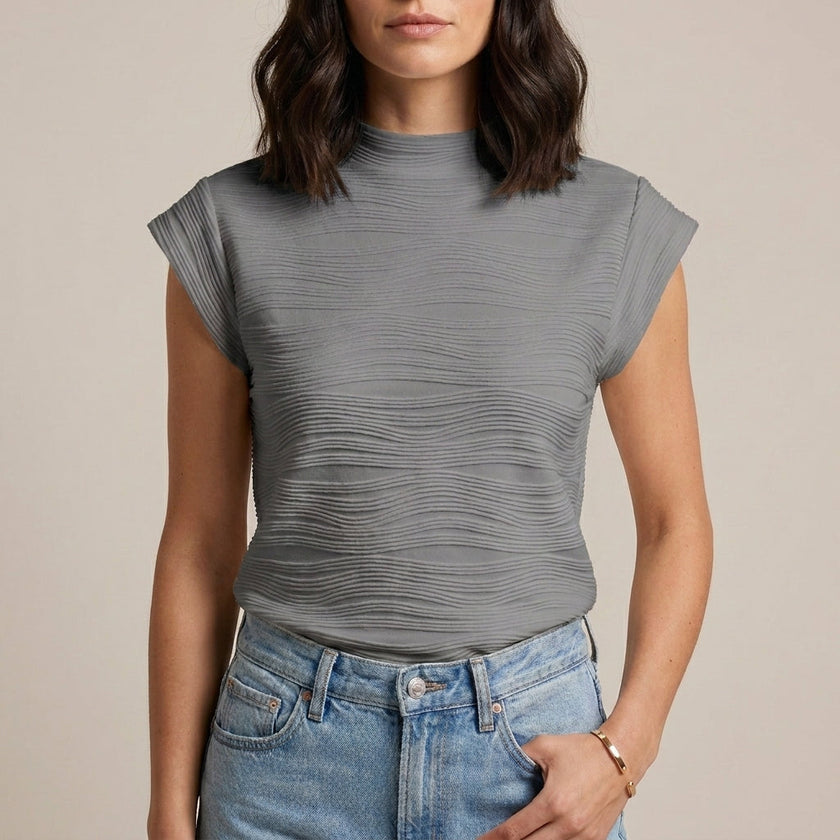 Gray women's summer top by FJØRNA featuring a high neckline and cap sleeves, laid flat to showcase the style and fabric.