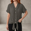 Gray women's summer blouse by FJØRNA featuring a V-neck, ruffle details, and casual denim fabric.