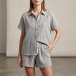 Gray textured vertical stripe relaxed two-piece shirt and drawstring shorts set by FJØRNA, casual and comfortable summer outfit.