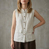 Gray sleeveless denim blouse for women with button front from FJØRNA, perfect for summer casual wear.