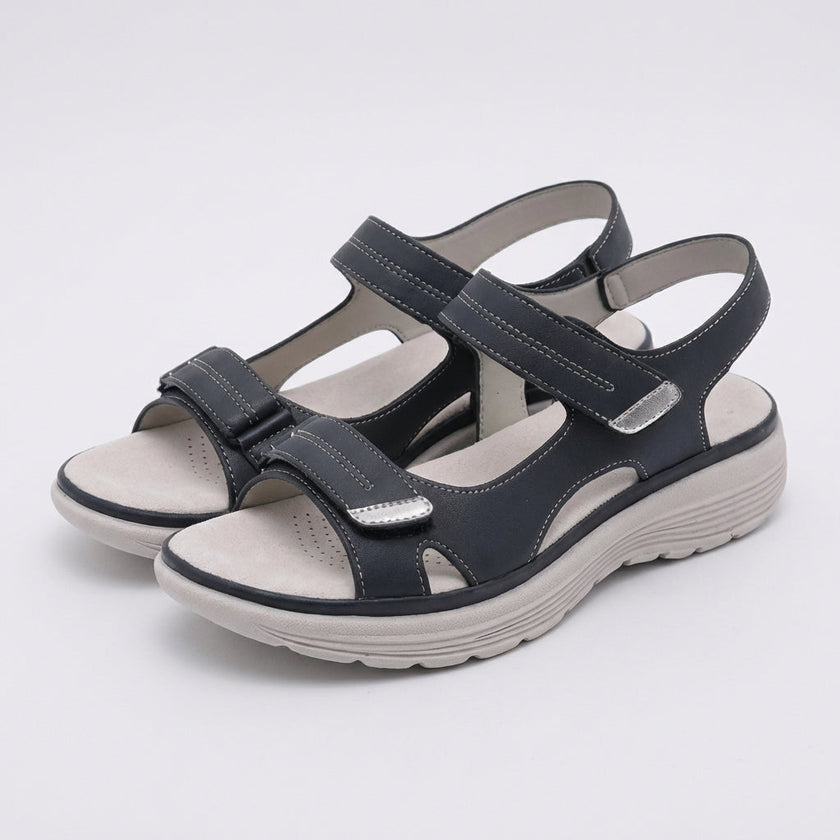 Gray FJØRNA orthopedic comfort fit sandals with chunky sole and adjustable straps, showcasing their supportive design and casual style.