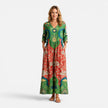 Green and red women's summer maxi dress by FJØRNA featuring a flowy, vibrant design perfect for warm weather.