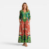 Green and red women's summer maxi dress by FJØRNA featuring a flowy, vibrant design perfect for warm weather.