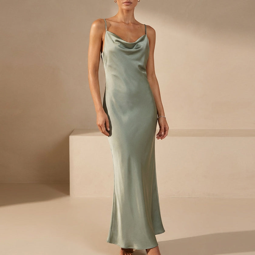 Green slim fit sleeveless maxi dress with cowl neck by FJØRNA, flowing fabric and elegant design perfect for summer occasions.
