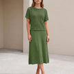 FJØRNA green flowing midi dress and cropped open-knit mesh top set, stylish 2-piece outfit with elegant, airy fabric.